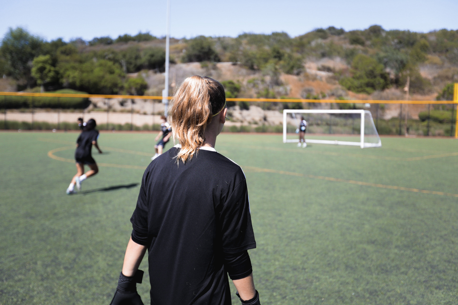 A 1991 player watching a training session from the touchline